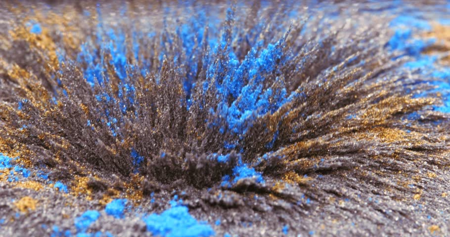 Yellow and blue metallic dust, chips, iron powder under the influence of a magnetic field. Abstract background. The surface is a color movable background. The natural phenomenon of magnetism of Royalty-Free Stock Footage #3395456685