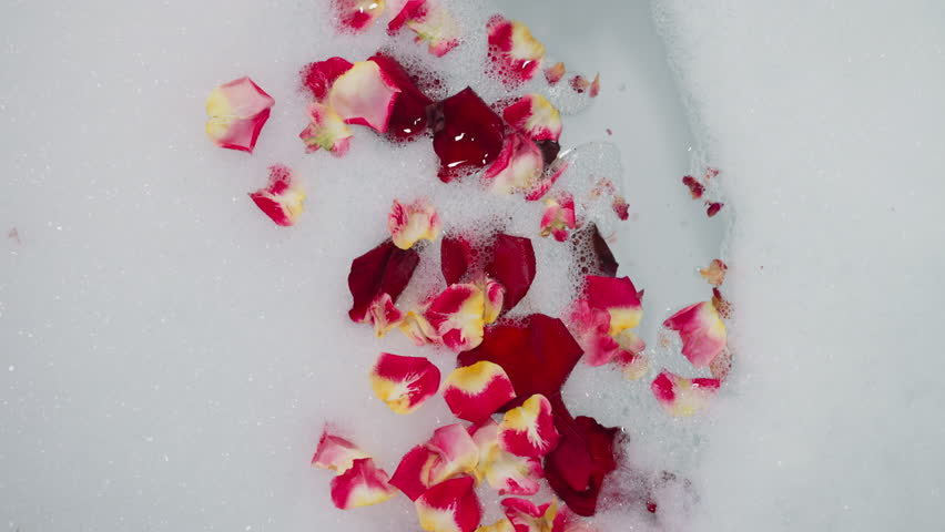 Romantic bathtub with flower petals and , Stock Video