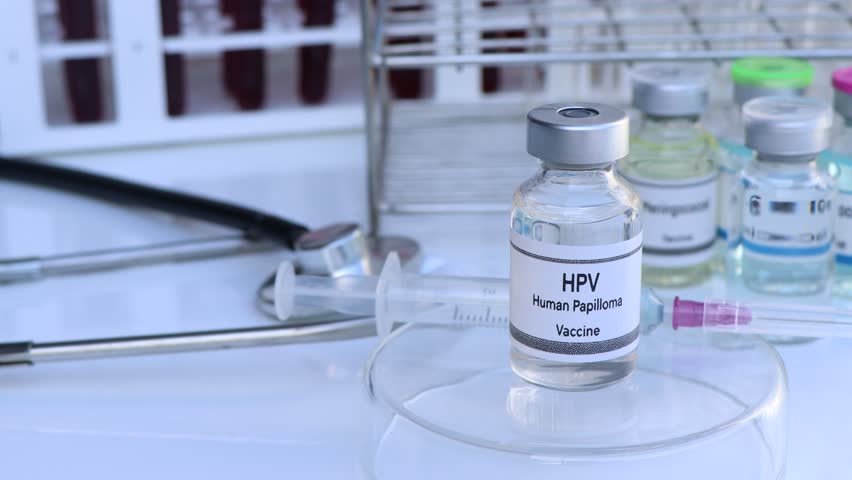 HPV vaccine in a vial, immunization and treatment of infection, scientific experiment Royalty-Free Stock Footage #3395569939