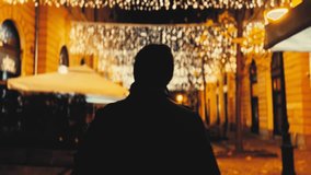 City lights bokeh with man walking silhouette - Powered by Shutterstock - Get 15% off with code: PIKWIZARD15