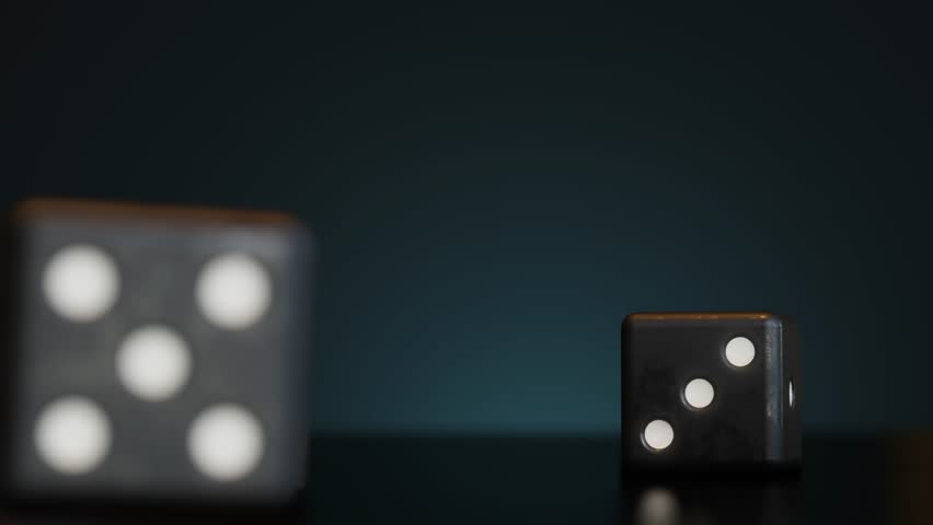 A bunch of thrown dices rolling on the table against dark background.