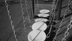 An obstacle course of metal platforms on chains on the playground. Close-up shooting - Powered by Shutterstock - Get 15% off with code: PIKWIZARD15