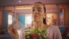Tracking Shot of a Beautiful Woman Enjoying a Vegan Meal in her Colorful Apartment. Female Vegetarian Following a Healthy Diet, Watching her Calories and Eating a Fresh Salad Made of Bio Ingredients - Powered by Shutterstock - Get 15% off with code: PIKWIZARD15