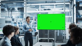 Autonomous Electronics Factory With Robotic Arms: Hispanic Female Team Lead Presenting Innovative Project To Diverse Engineers And Technicians On TV With Green Screen Chromakey In Office Meeting Room. - Powered by Shutterstock - Get 15% off with code: PIKWIZARD15