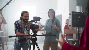 Slow Motion Footage of Behind the Scenes of Creating a Commercial: Young Film Industry Professionals Working on Set to Make Video Content for Marketing. Film Crew Collaborating on a Cinematic Project - Powered by Shutterstock - Get 15% off with code: PIKWIZARD15