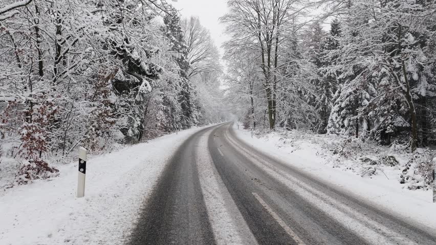 Aerial view of a snowy road in northern germany Royalty-Free Stock Footage #3396157017