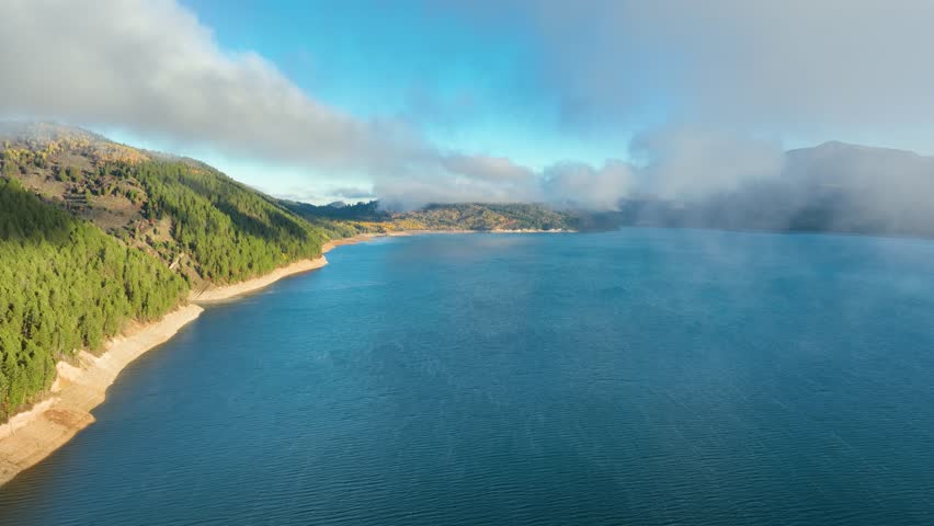 Aerial of low clouds above the Palisades Reservoir on the Snake River in Idaho.