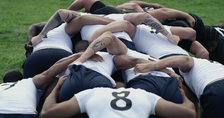 Group, rugby men and scrum on field, contest and power for territory, sports or grass with support. Team back, push and huddle for ball, game or competition at stadium, park or outdoor for tournament Royalty-Free Stock Footage #3396182515