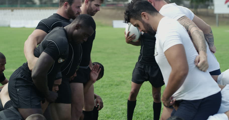 Group, rugby men and scrum with sports, contest and power for territory, field and grass with support. Team, push and huddle for ball, game or competition at stadium, park or outdoor for tournament Royalty-Free Stock Footage #3396188007