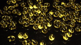Many yellow gelcaps lying on table in darkness, illegal medicine trade, illegal medicine market, corruption of doctors and pharmacists, close-up - Powered by Shutterstock - Get 15% off with code: PIKWIZARD15