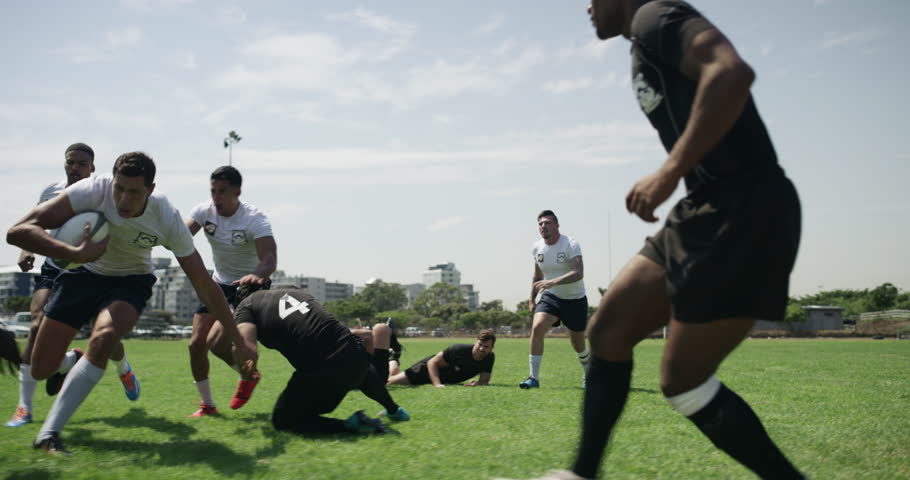 Team, rugby men and try with sports, contest and power for winning, field and grass with support. Team, push and tackle for ball, games and competition at stadium, goals and outdoor for tournament