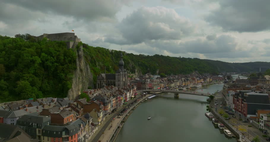 Establishing aerial shot of Dinant, Belgium drone cinematic video. Beautiful Belgian city on the river bank. Summer time in the tourist center of Dinant
