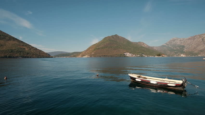 Boat in the Bay of Kotor, Perast.  View of the mountains in Montenegro
