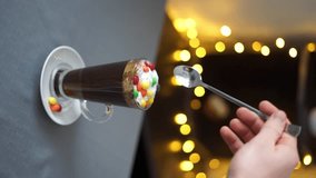 drink with colorful candies vertical video