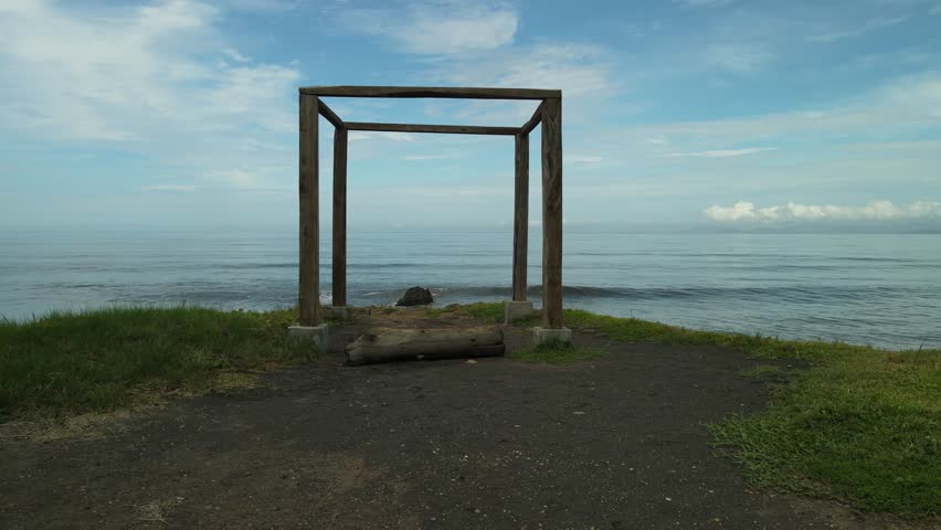 Logs form a Cube in precipice facing the sea