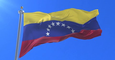 Venezuela flag waving at wind in slow with blue sky, loop