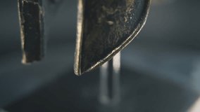 A close up macro spiral slow tilt up shot of a spartan face design, warrior ancient greek bronze helmet, on a 360 rotating stand, studio lighting, 4K smooth movement - Powered by Shutterstock - Get 15% off with code: PIKWIZARD15