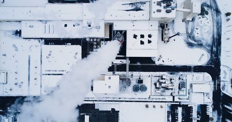 aerial view of a factory under the snow