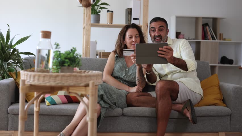 happy mature couple order fast food at home with credit card - Powered by Shutterstock - Get 15% off with code: PIKWIZARD15