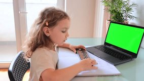 A girl from the back is engaged in mental arithmetic on the abacus online on a laptop, chroma key background. The concept of teaching children to count quickly, Russian mathematics. 