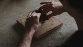 Embark on a captivating journey into the world of a skilled Latino artisan, where the hands of creativity mold and shape clay into a unique masterpiece. In this mesmerizing video, discover the