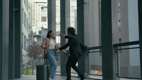 Indian businesswoman arrive in city with travel bag baggage luggage case Arabian businessman meet hug female partners business meeting in airport outdoors hugging colleagues coworkers friends greeting - Powered by Shutterstock - Get 15% off with code: PIKWIZARD15