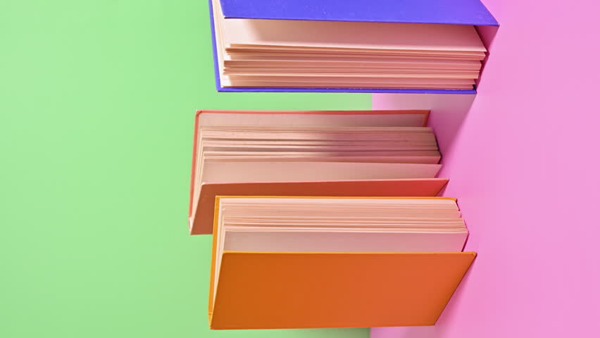 Pastel Pages Unveiled: Vertical Stop Motion of Books Appearing