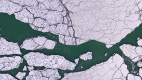 Frozen Lake Michigan with Ice Blocks on Frosty Winter Day. Aerial Top-Down View. Chicago, United States of America. Drone Flies Sideways. Vertical Video - Powered by Shutterstock - Get 15% off with code: PIKWIZARD15