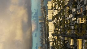 Urban Skyline of Miami Beach and Miami Downtown at Sunrise. Aerial View. USA. Drone Flies Sideways. Vertical Video