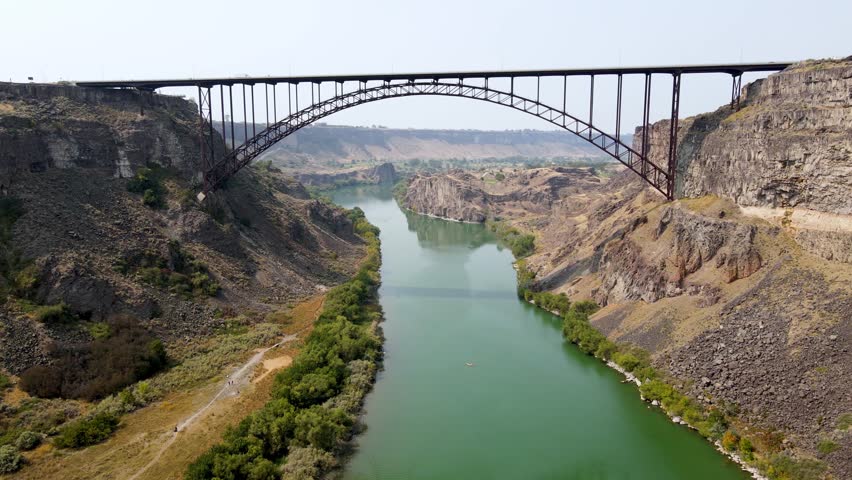 Aerial view of the Perrine Memorial Bridge over the snake river in Twin Falls, Idaho. With cars driving across the bridge.