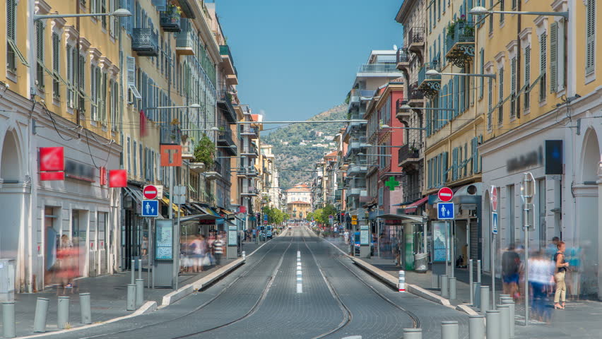 View of Place Garibaldi timelapse with trams on the street and traffic. It is named after Giuseppe Garibaldi, hero of Italian unification (born in Nice). Place Garibaldi is monumental example of
