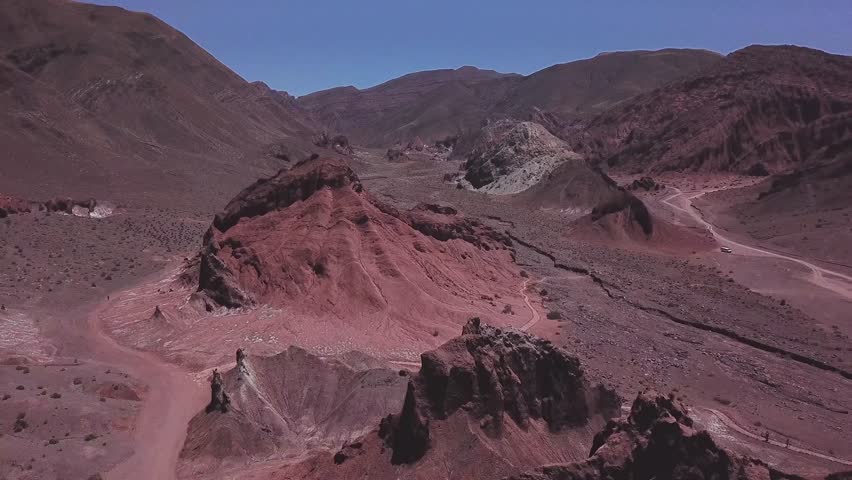 Epic aerial view of flock of Chilean flamingos flying at the shallow lake, Bolivia Chile Route, Bolivia