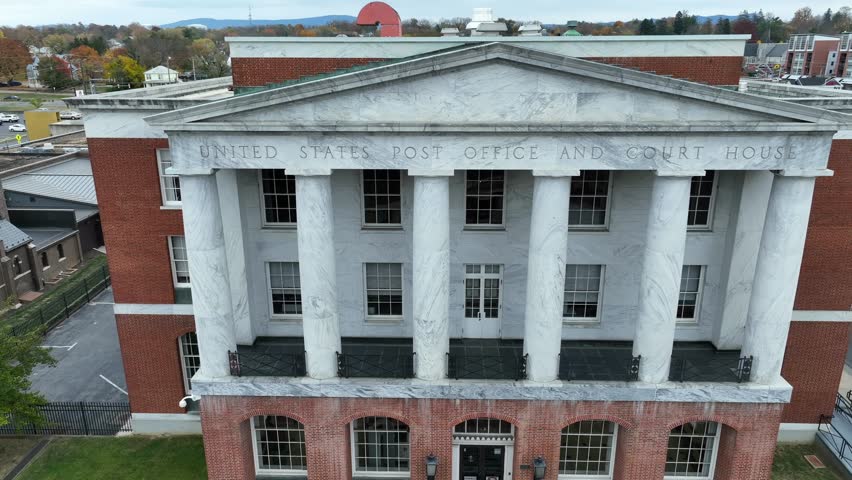 United States Post Office and Court House. Aerial establishing shot of government building in town in USA in autumn. Ornate marble pillars.