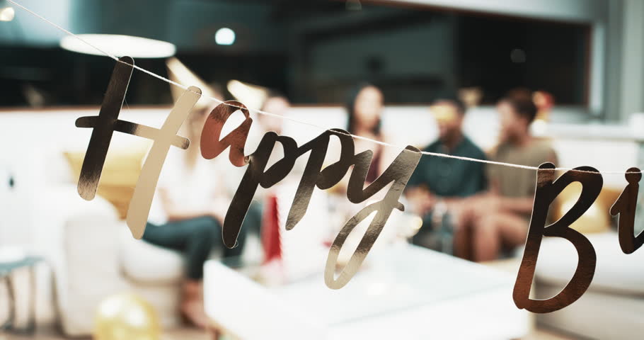 People, birthday party and banner in living room with talking, together and gifts with celebration in apartment. Friends, diversity or conversation by presents with hats or cake with candles in house