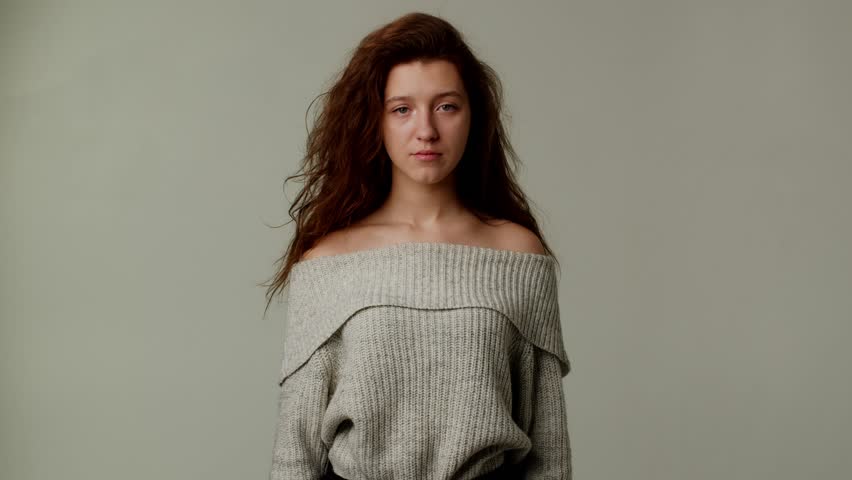 Funny red hair girlfriend waving head to show her disagreement. Woman doesn