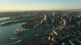 Aerial view Real time Footage of above Sydney Central Business District with Harbor bridge, Various Modern Office Building and Opera House at the sunrise time, Sydney