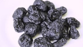 Prunes,  Dried plums rotate close up. Stock video