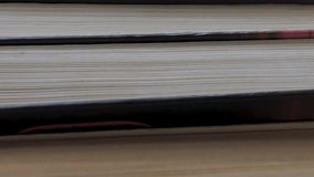 Book shelf's in library. Close up Many books organized in shelves in a big bookstore. The concept of learning, reading, and knowledge. Vertical video - Powered by Shutterstock - Get 15% off with code: PIKWIZARD15