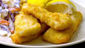 4K Close-Up Video: Squeezing Lemon Over Fish and Chips with Sauce - Culinary Delight
