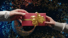 Couple hands, New year gift giving on glitter decorations. Holiday projects - Powered by Shutterstock - Get 15% off with code: PIKWIZARD15