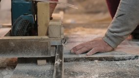 A woodworker's hands operate a saw, focus on detail. Highlights the importance of safety in manual work environments. - Powered by Shutterstock - Get 15% off with code: PIKWIZARD15