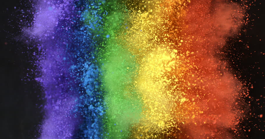 Super slow motion close up of rainbow flag of peace explosion of colorfoul powder with flying particles isolated on black background at 1000 fps.
