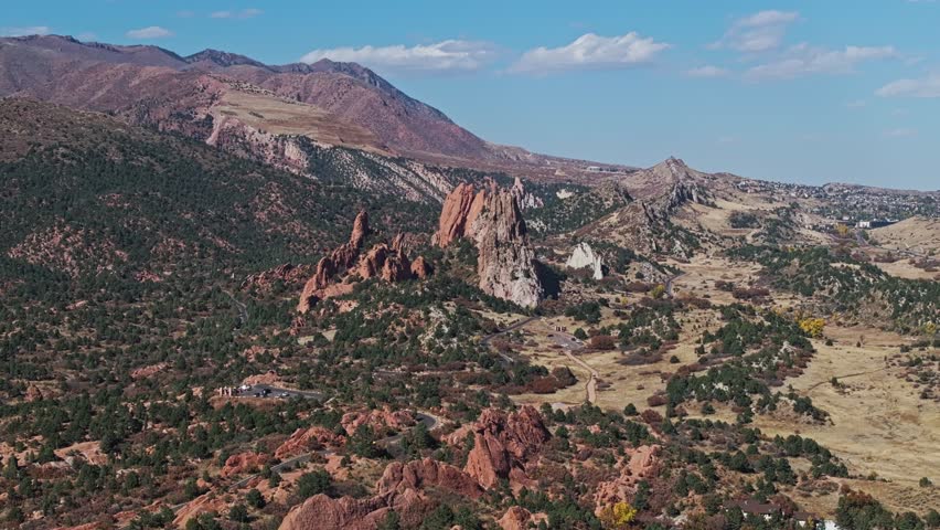 Towering rock formations of Garden of the Gods Colorado amidst juniper pinyon shrublands