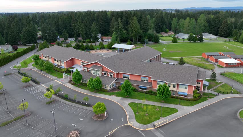 Aerial view of a public building with voting checkmarks appearing overhead.