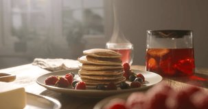 American traditional breakfast pancakes against backdrop of cozy kitchen. No people advertising cinematic. Sharing healthy eating gluten-free sugar-free recipes food. Homemade food and comfort concept