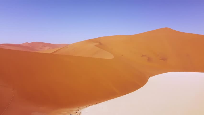 4k Drone Flying Over Deadvlei, near Sossusvlei White Salt Pan, Namib-Naukluft Park, Namibia. Explore the World's Tallest Sand Dunes – Big Daddy and Crazy Dune. Surreal Desert Landscape and Atmosphere Royalty-Free Stock Footage #3397476499