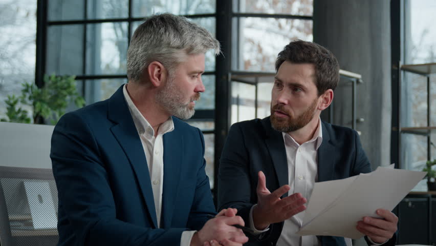 Two disgruntled furious Caucasian businessmen arguing about bad contract in office men colleagues partners dispute incorrect document failed transaction deal conflict problem shouting break agreement Royalty-Free Stock Footage #3397490773