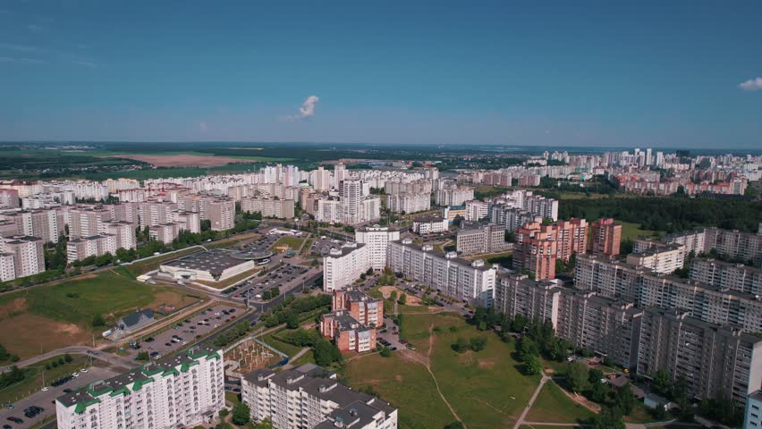 Aerial view of residential microdistrict on outskirts of city with parking for cars and modern infrastructure Royalty-Free Stock Footage #3397557017