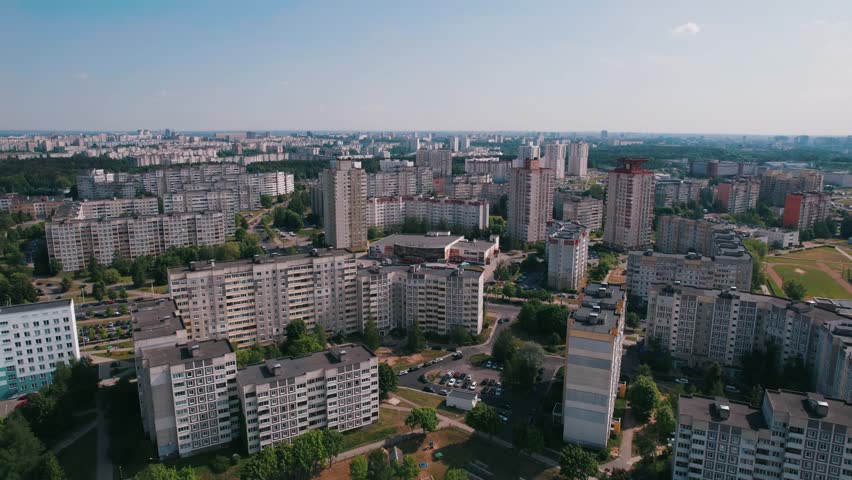 Aerial view of modern residential neighborhood with high-rise buildings and green recreation areas Royalty-Free Stock Footage #3397557371