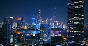 Aerial shot of Shanghai city financial district skyline at night in China. Creative category video without architectural logos